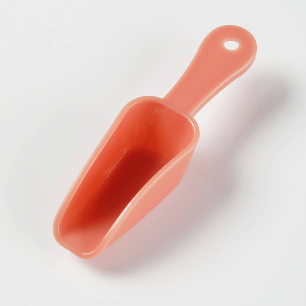 Soil Orange plastic spoon